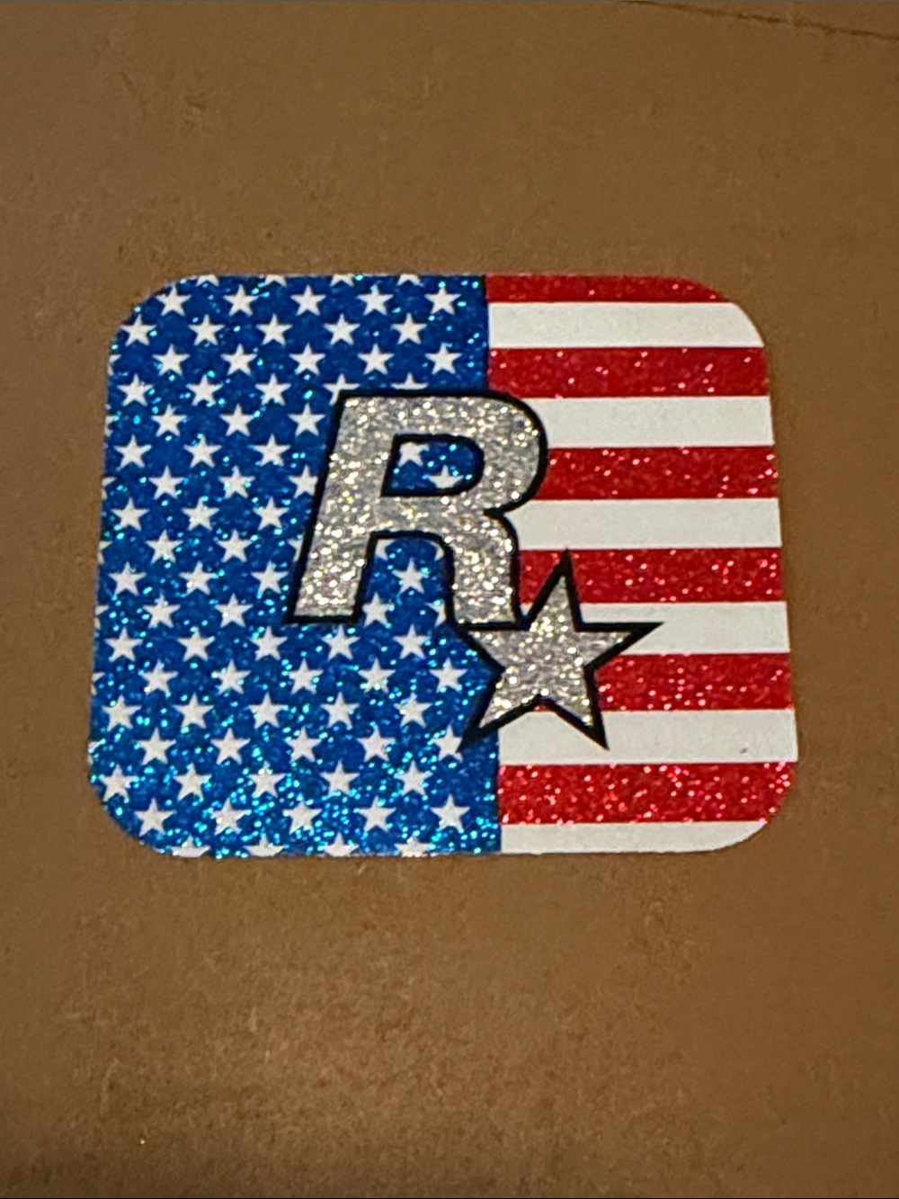 ROCKSTAR GAMES STICKER with R* USA flag glitter logo